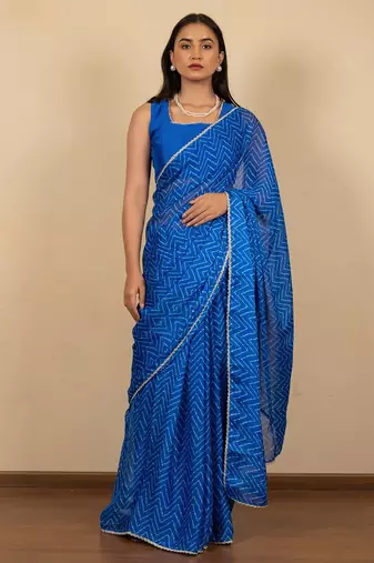 Women's royal blue chevron print golden lace border chiffon saree with unstiched blouse piece