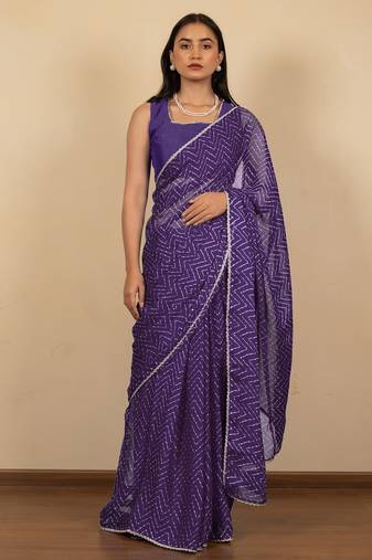Women's purple chevron print golden lace border chiffon saree with unstiched blouse piece