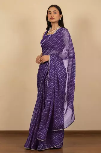 Women's purple chevron print golden lace border chiffon saree with unstiched blouse piece