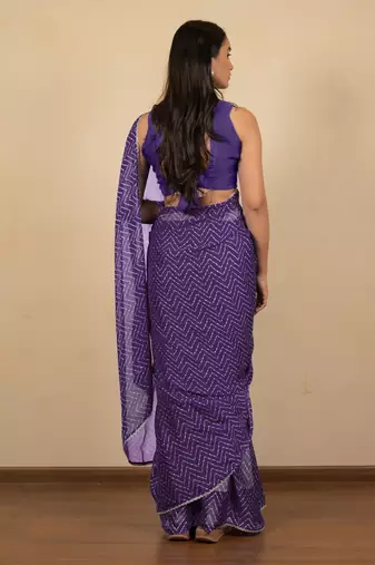 Women's purple chevron print golden lace border chiffon saree with unstiched blouse piece