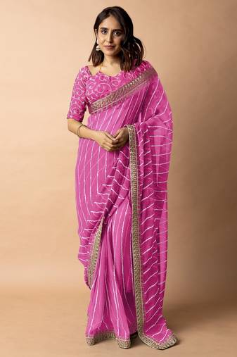 Women's pink striped leheriya print embroidered lace border georgette saree with unstiched blouse piece
