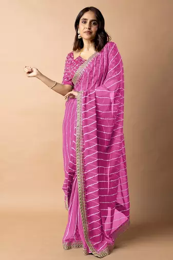 Women's pink striped leheriya print embroidered lace border georgette saree with unstiched blouse piece