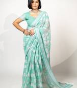 Women's teal floral print silver zari border cotton blend saree with unstiched blouse piece