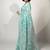Women's teal floral print silver zari border cotton blend saree with unstiched blouse piece