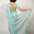 Women's teal floral print silver zari border cotton blend saree with unstiched blouse piece