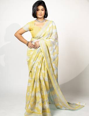 Women's pastel yellow floral print silver zari border cotton blend saree with unstiched blouse piece 1