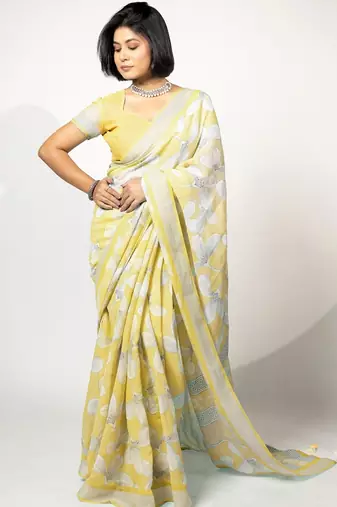 Women's pastel yellow floral print silver zari border cotton blend saree with unstiched blouse piece