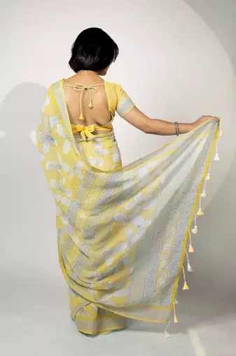 Women's pastel yellow floral print silver zari border cotton blend saree with unstiched blouse piece