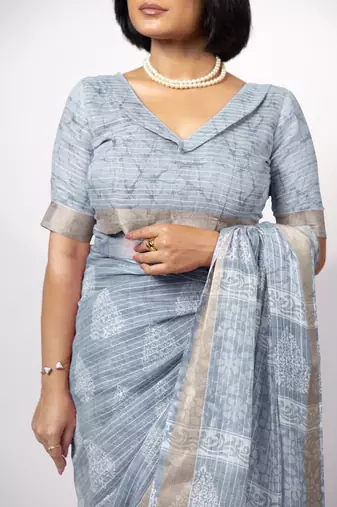 Women's greyish blue block print golden zari woven cotton blend saree with unstiched blouse piece