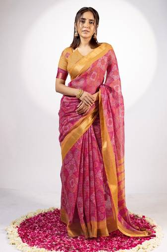 Women's rani pink ajrakh print golden zari woven cotton blend saree with unstiched blouse piece