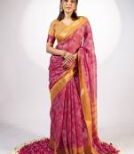 Women's rani pink ajrakh print golden zari woven cotton blend saree with unstiched blouse piece