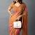 Women's rust foil bandhani print golden lace border chiffon saree with unstiched blouse piece