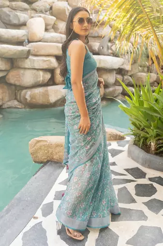 Women's turquoise floral print silver zari border cotton blend saree with unstiched blouse piece