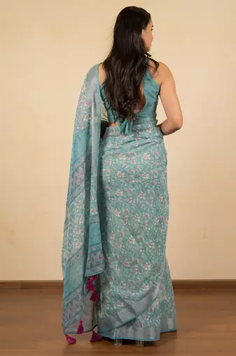 Women's turquoise floral print silver zari border cotton blend saree with unstiched blouse piece