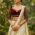 Cream embroidery chinon lahariya saree with readymade embroidery stitched blouse