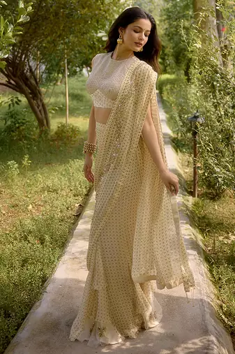 Cream embroidered georgette saree