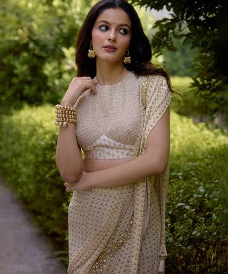 Cream embroidered georgette saree 4