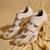 White embroidered leather heels