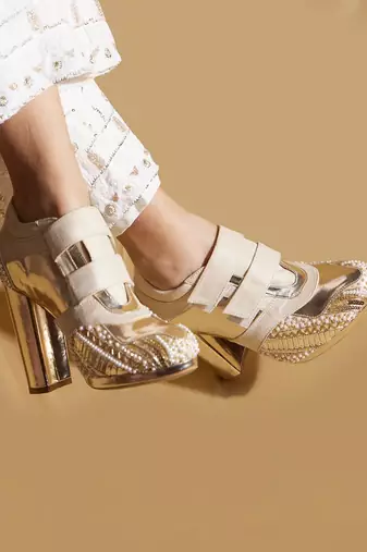 White embroidered leather heels