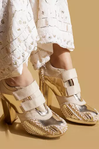 White embroidered leather heels
