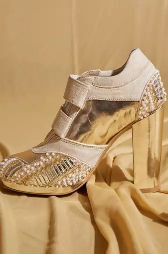 White embroidered leather heels
