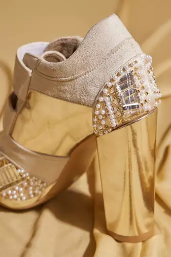 White embroidered leather heels