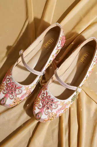 White embroidered satin ballerinas