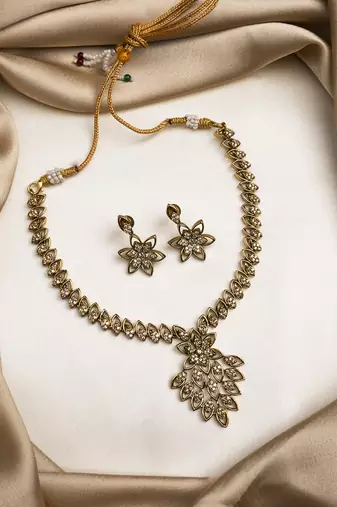Gold plated ad studded leaf style attigai necklace set
