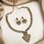 Gold plated ad studded leaf style attigai necklace set