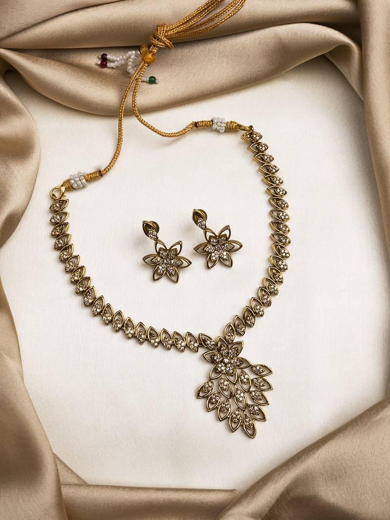 Gold plated ad studded leaf style attigai necklace set