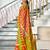 Orange printed cotton saree with blouse piece