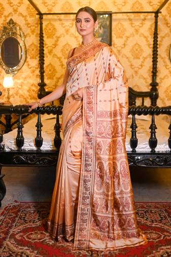 Beige pure handwoven baluchari silk saree with exquisite resham work in copper color