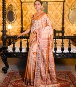 Beige pure handwoven baluchari silk saree with exquisite resham work in copper color