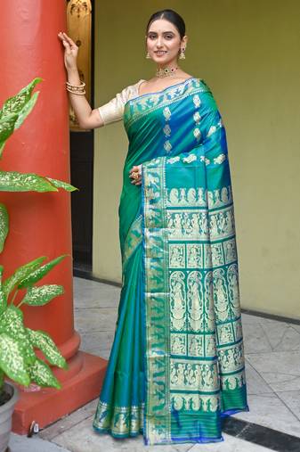 Green dual toned pure handwoven baluchari silk saree with exquisite resham work in copper color