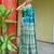 Green dual toned pure handwoven baluchari silk saree with exquisite resham work in copper color