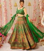 Green Color Ethnic And Graceful Ceremonial Wear Printed Lehenga