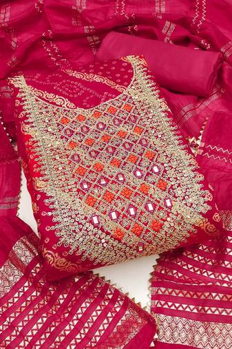 Deep magenta suit set with intricate mirror work and embroidered dupatta