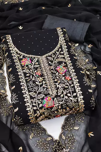 Black georgette suit set with intricate golden zari embroidery and floral accents
