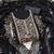 Black georgette suit set with intricate golden zari embroidery and floral accents