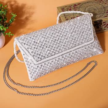 Osty sitara – premium hand-zari embellished bridal clutch with beaded handle & gold chain-white 1