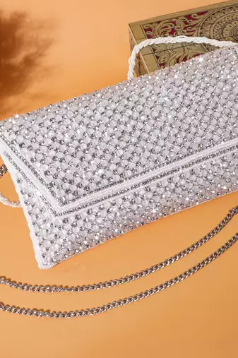 Osty sitara – premium hand-zari embellished bridal clutch with beaded handle & gold chain-white