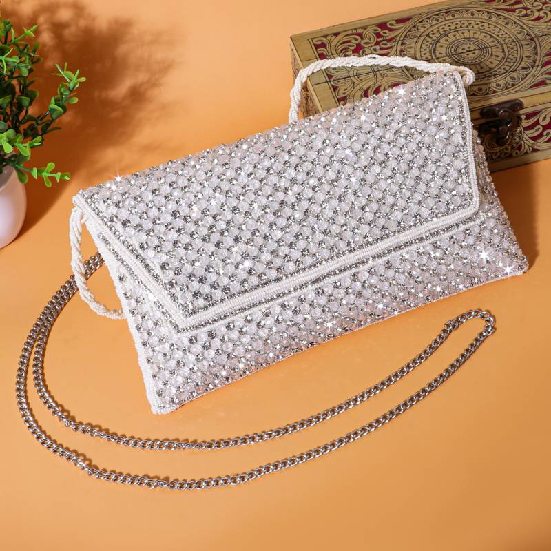 Osty sitara – premium hand-zari embellished bridal clutch with beaded handle & gold chain-white