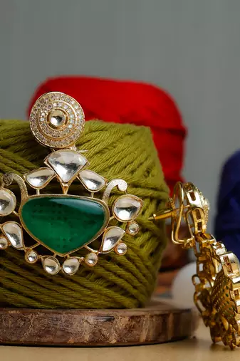 Green stone gold plated earrings