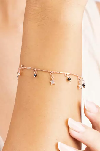 Star charm bracelet with black beads