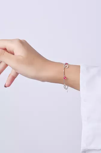 Pink bead and circle charm bracelet