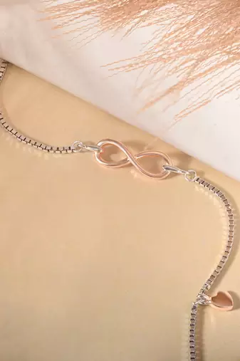 Infinity charm bracelet with heart drop