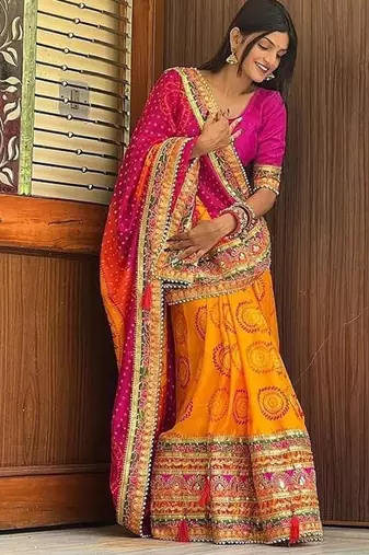 pink & yellow bandhani silk saree with embroidered border