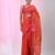 Vibrant orange tant saree with leaf borders