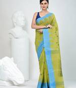Vibrant lime green & blue handwoven tant cotton saree with traditional motifs