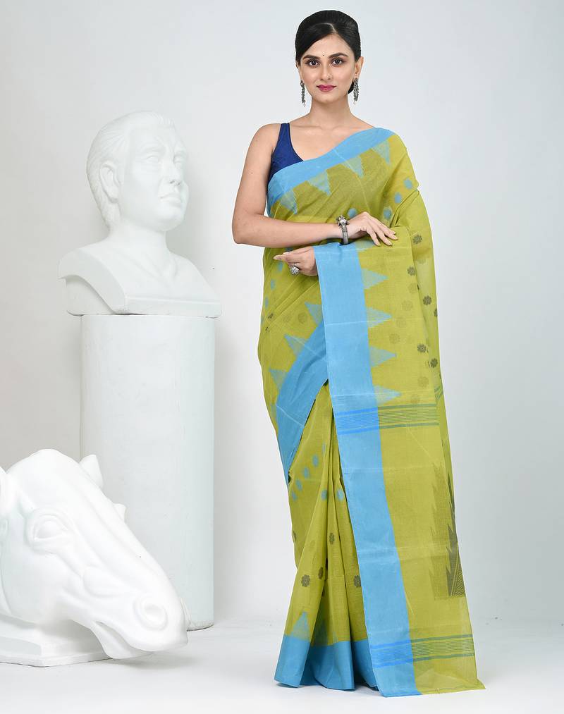 Vibrant lime green & blue handwoven tant cotton saree with traditional motifs